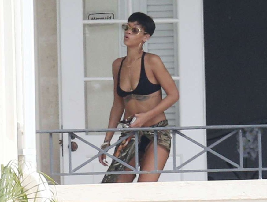 Rihanna - wearing a black bikini in Barbados